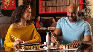 Rim-Asian-Bistro-couple-enjoy_sushi-and-sake-hero-image_v01_1920x1080