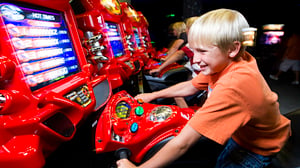 Arcade games in action with young guest.